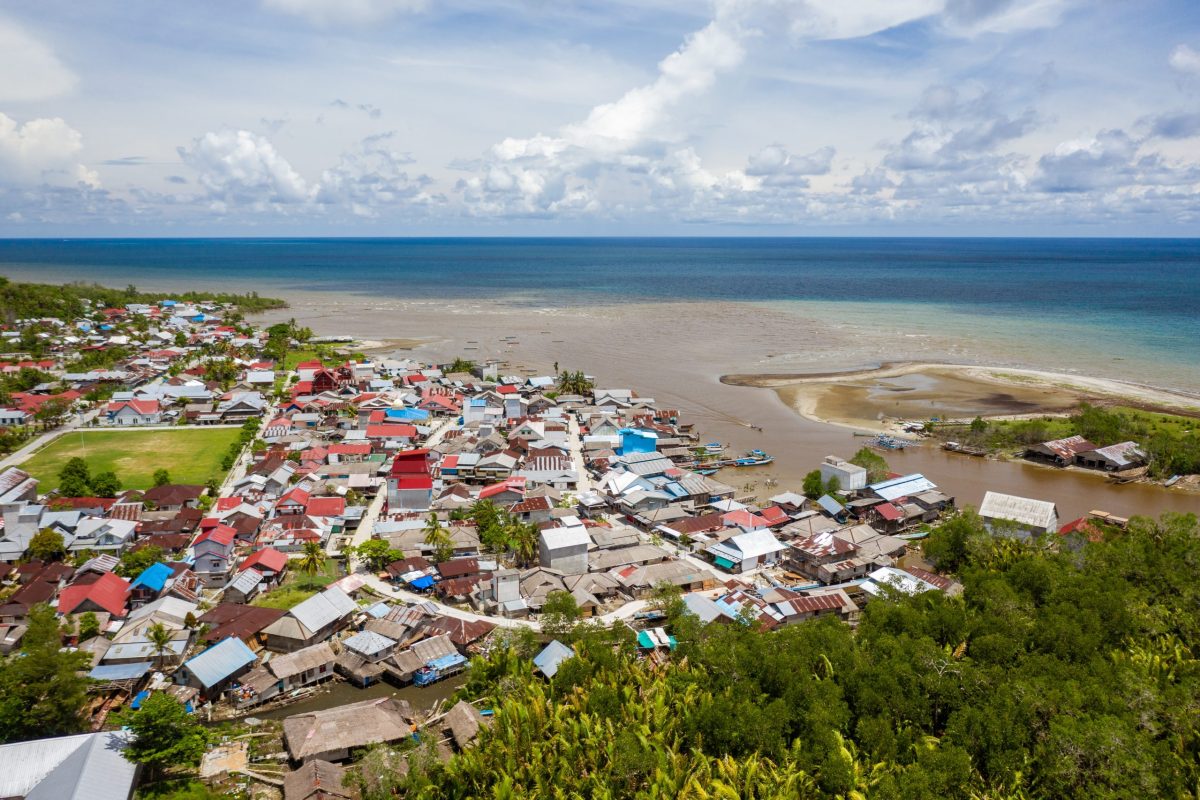 A beautiful shot of the town near the shore of a calm sea in Mentawai islands, Indonesia